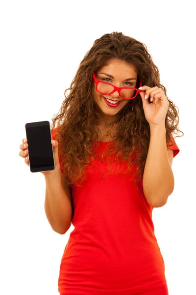 Beautiful young woman in red showing blank display of a smart ph — Stock Photo, Image
