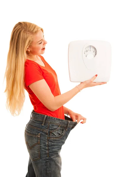 Mulher usa calças muito grandes como ela perder peso - perda de peso — Fotografia de Stock