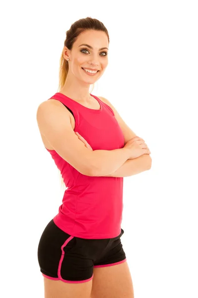 Beautiful sporty woman standing with crossed arms isolated over — Stock Photo, Image