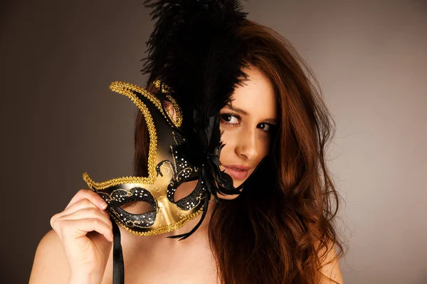 Atractive young woman with venice mask studio portrait — Stock Photo, Image