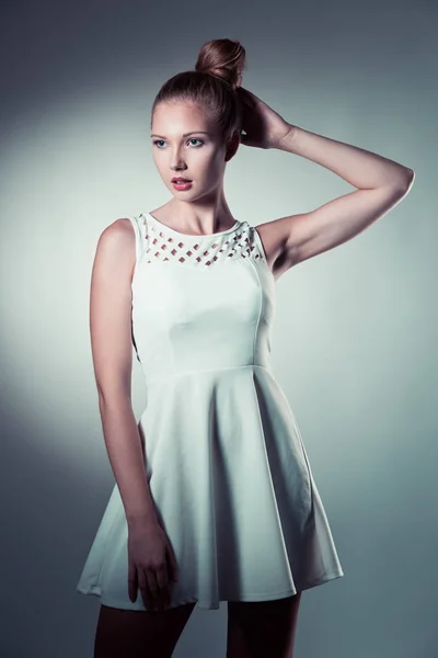 Moody studio portrait of a beautiful young brunette woman with l — Stock Photo, Image