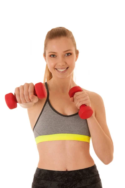 Beautiful young fit woman works out with dumbbells isolated over — Stock Photo, Image
