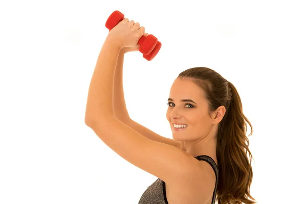 Hermosa mujer en forma joven funciona con pesas aisladas sobre —  Fotos de Stock