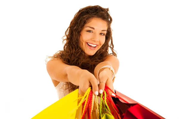 Attractive young caucasian woman with shopping bags isolated ove — Stock Photo, Image