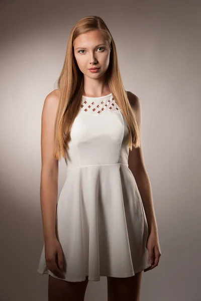 Moody studio portrait of a beautiful young brunette woman with l — Stock Photo, Image