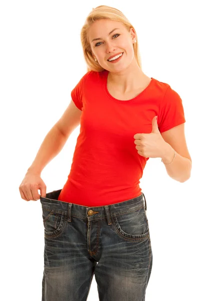 Woman wears too big trousers as she loose weight - weightloss — Stock Photo, Image