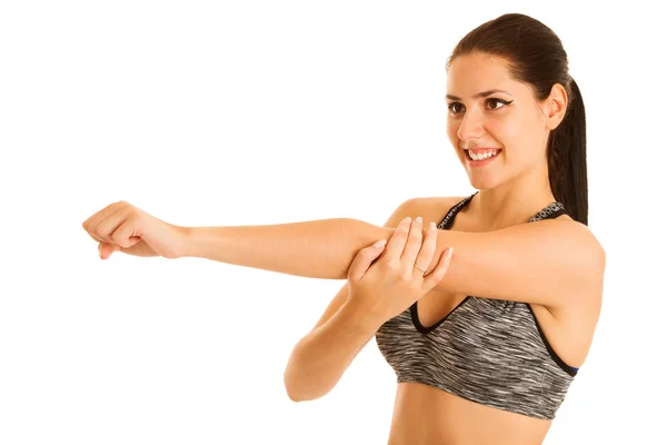 Active young fit woman stretching arm isolated over white backgr — Stock Photo, Image