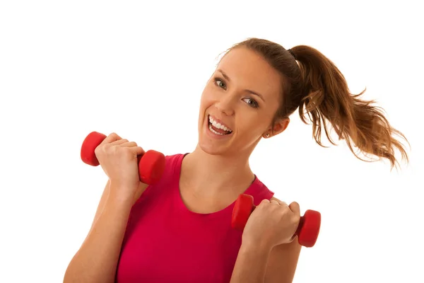 Beautiful young active fit woman workout with dumbbells isolated Royalty Free Stock Photos