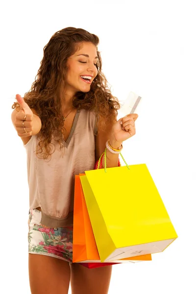 Attraktive junge kaukasische Frau mit Einkaufstaschen — Stockfoto