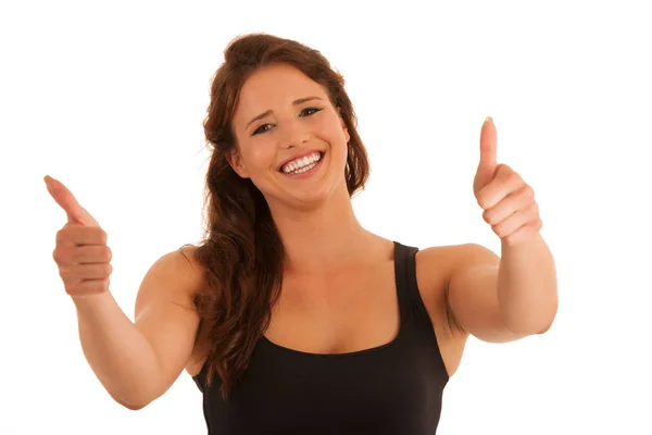 Beautiful young brunette woman gesturing success with thumb up i — Stock Photo, Image