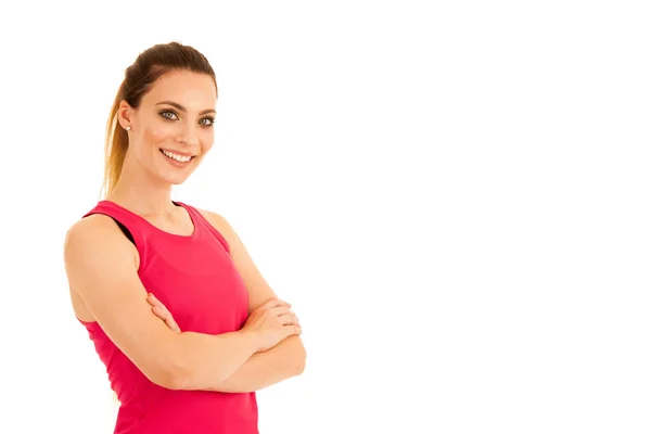 Beautiful sporty woman standing with crossed arms isolated over — Stock Photo, Image