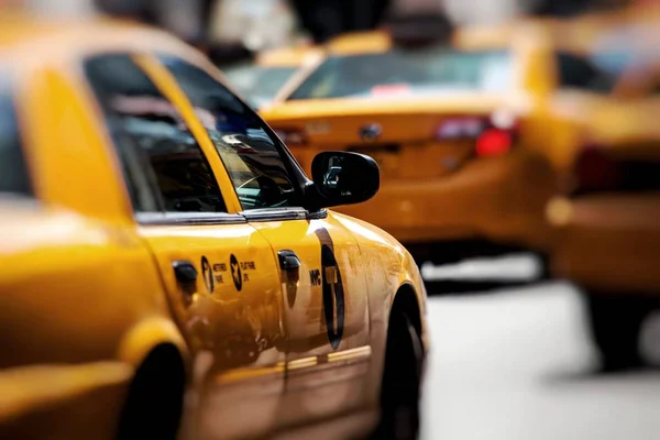 Yellow cab speeds through Times Square in New York, NY, USA. — Stock Photo, Image