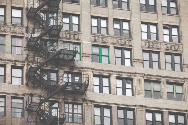 Metal fire escape outside apartment building for emergency