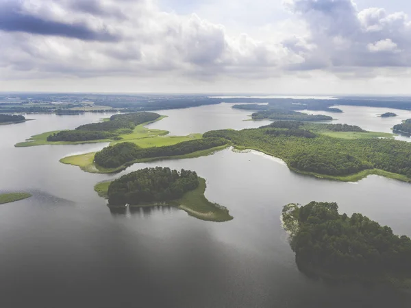 Aerial view of green islands and clouds at summer sunny morning. — Stock Photo, Image