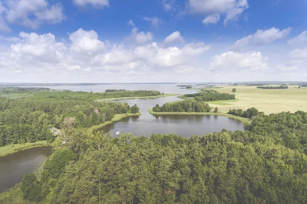 Aerial view of green islands and clouds at summer sunny morning. — Stock Photo, Image