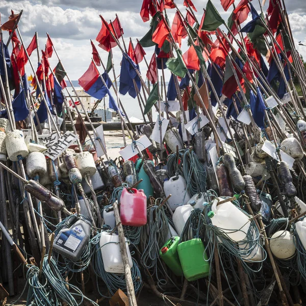 Network fishing drying on the beach in sunny day. Baltic Sea and — Stock Photo, Image