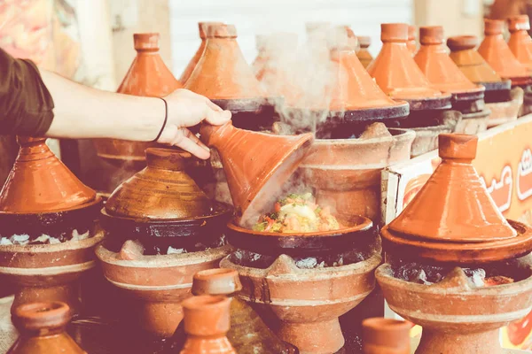 Cooking traditional Moroccan dish, meat and vegetable in ceramic — Stock Photo, Image