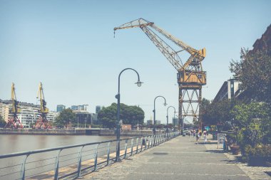 BUENOS AIRES, ARGENTINA - FEBRUARY 05, 2018: Old cranes in Puert clipart