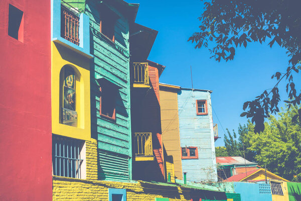 Colorful area in La Boca neighborhoods in Buenos Aires. Street is a major tourist attraction & the area is filled with colorfully painted buildings.