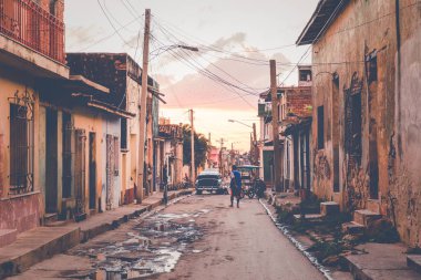 TRINIDAD, CUBA - DECEMBER 16, 2019: Colorful houses and vintage 