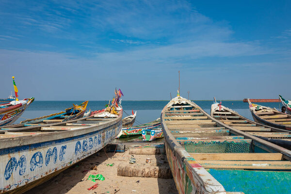 Traditional painted wooden fishing boat in Djiffer, Senegal. Wes