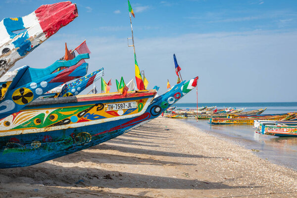 Traditional painted wooden fishing boat in Djiffer, Senegal. Wes