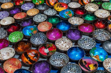 Souvenir colourfully lacquer bowls on the market at Luang Praban