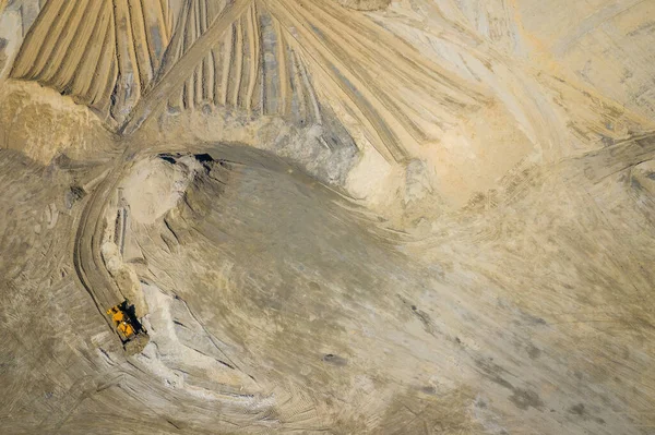 stock image Aerial view of industrial mineral open pit mine. Opencast mining quarry with lots of machinery at work. Drone view from above.