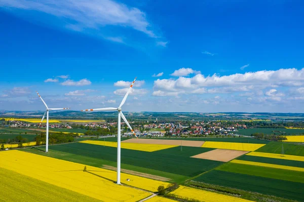 Aerial View Wind Turbine Rapeseed Blooming Windmills Yellow Fields Agricultural — Stock Photo, Image