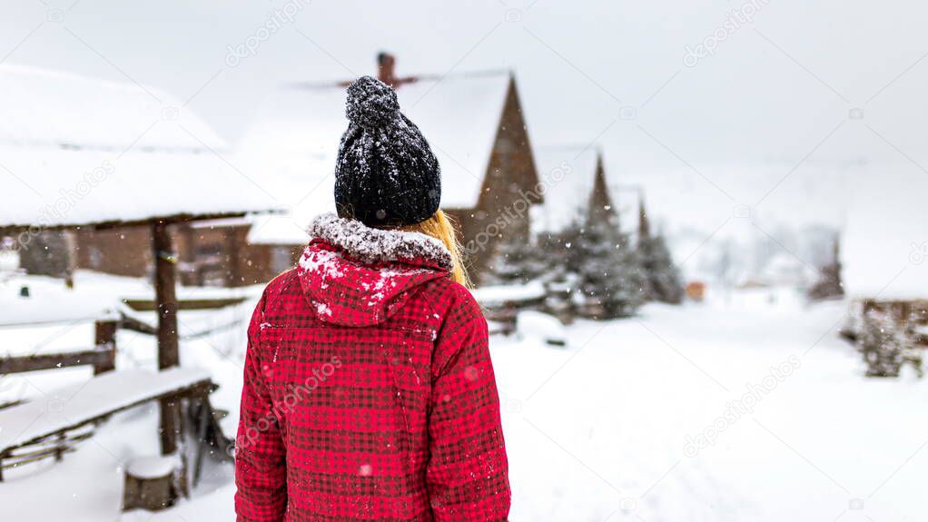 girl backs in winter snow street walk outdoor countryside, walk alone travel, cold weather, woman red jacket clothes