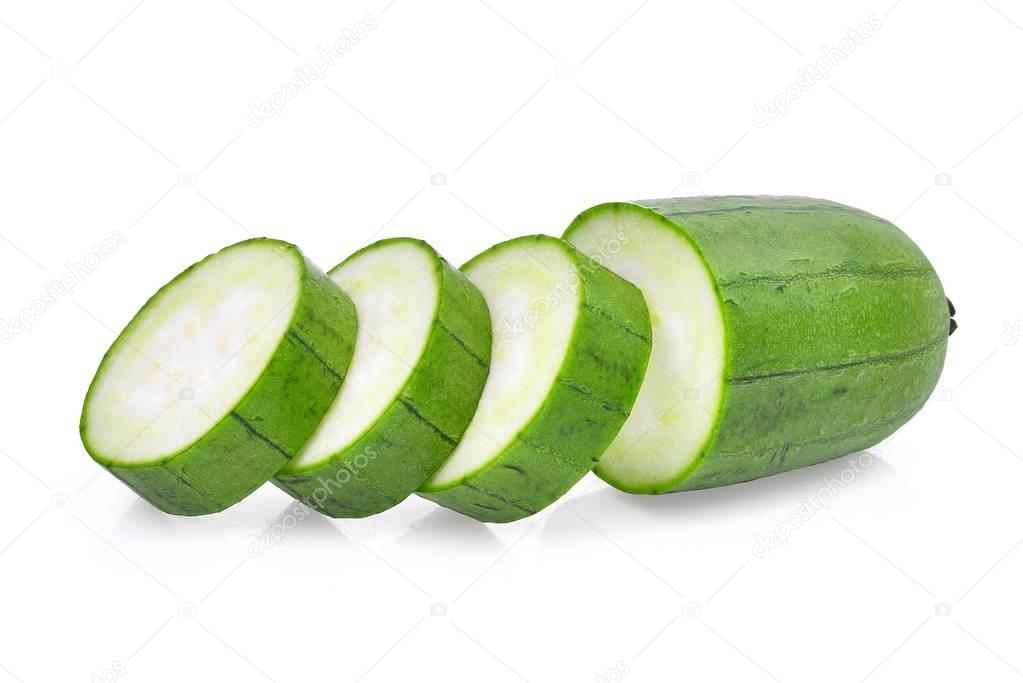 fresh green sponge gourd or luffa with slice isolated on white b