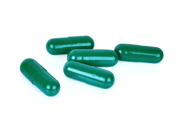 Groene capsule pillen isoated op witte achtergrond — Stockfoto