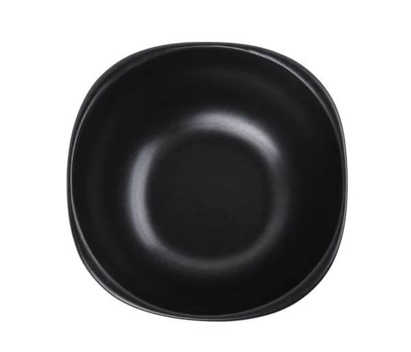 Верхний вид пустой черной чаши изолирован на белом фоне — стоковое фото
