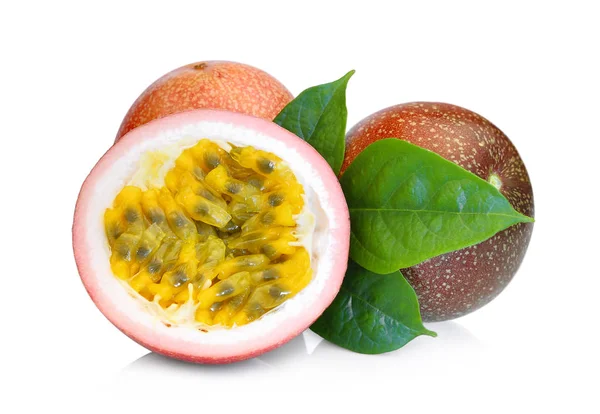 Whole and half of passion fruit with green leaves isolated on wh — Stock Photo, Image