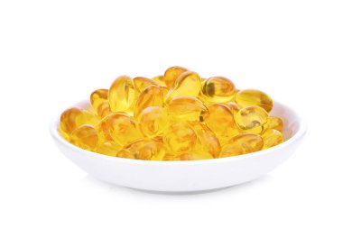 Balık yağı kapsülleri omega 3 ve beyaz tabak içinde D vitamini ile 