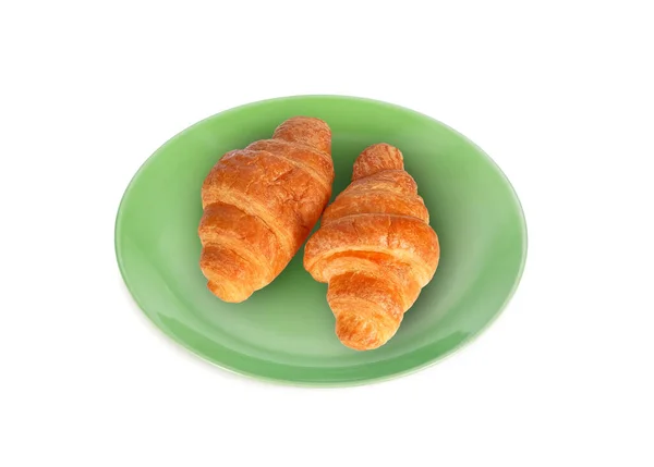 Croissant Den Gröna Plattan Isolerad Vit Bakgrund — Stockfoto