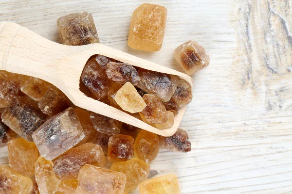 Caramelized sugar on wooden surface — Stock Photo, Image