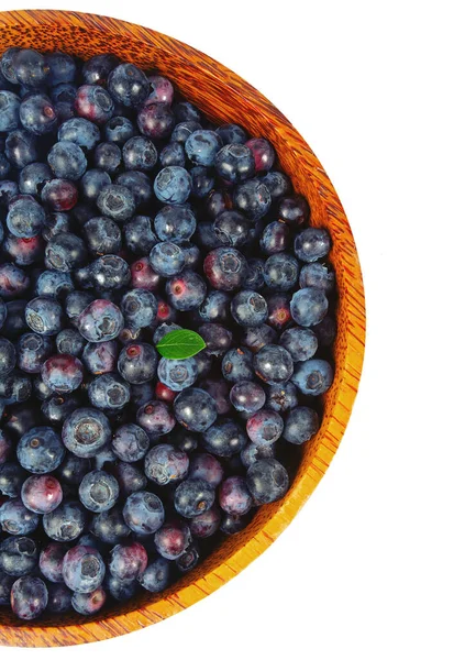 Fresh blueberries in a wooden bowl — Stock Photo, Image