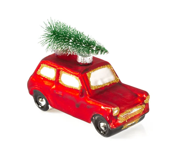 Decorazione natalizia - auto rossa e albero sul tetto — Foto Stock