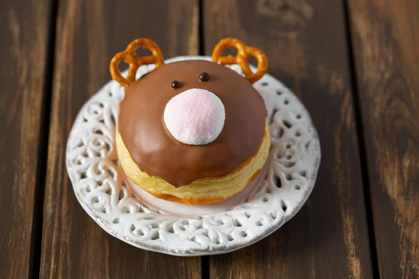 Reindeer doughnut on brown wooden surface — Stock Photo, Image