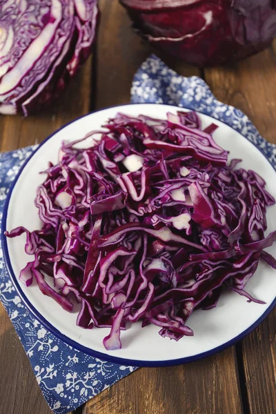 Red cabbage on brown wooden surface — Stock Photo, Image