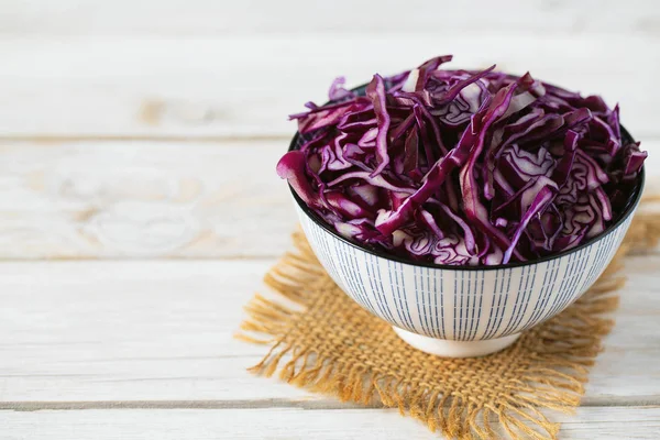 Red cabbage on white wooden surface — Stock Photo, Image