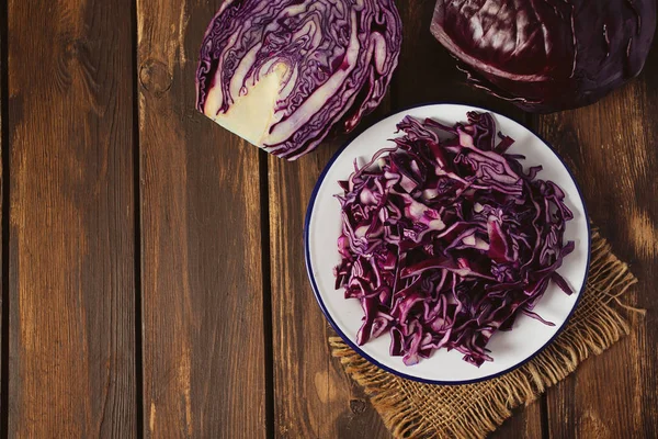 Red cabbage on brown wooden surface — Stock Photo, Image