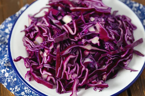 Red cabbage on brown wooden surface — Stock Photo, Image