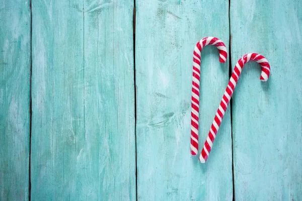 Striped Christmas Candy Cane Turquoise Surface — Stock Photo, Image