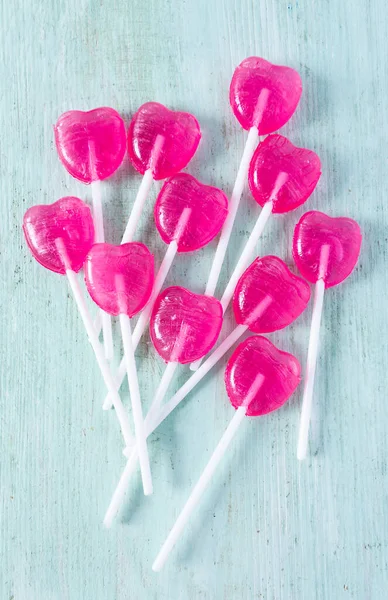 Heart Shaped Lollipops Turquoise Surface — Stock Photo, Image