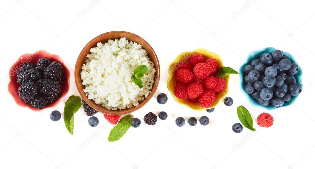 fresh cottage cheese and berries isolated on white