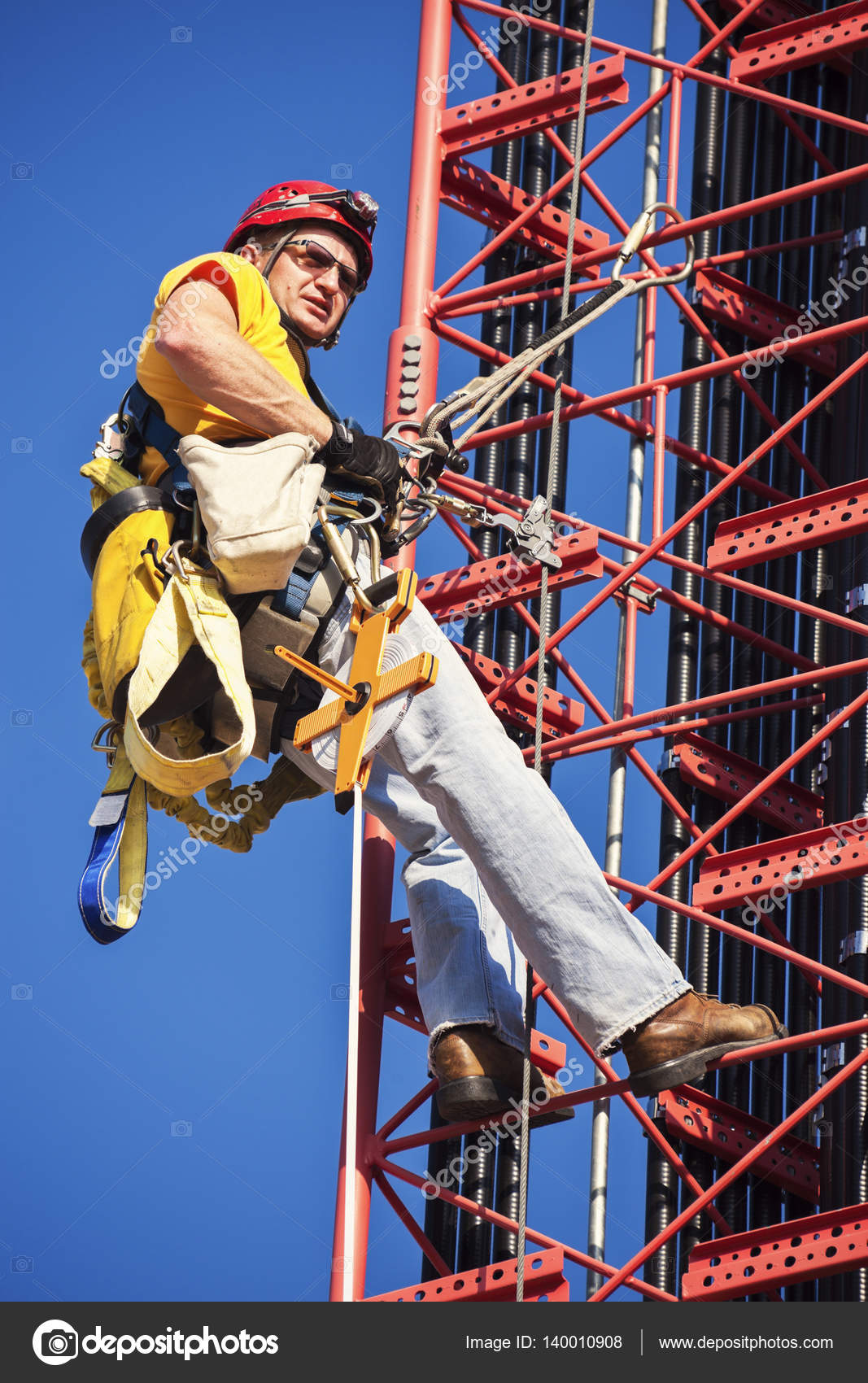 Climber ascending cell tower Stock Photo by ©benkrut 140010908