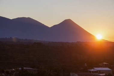 Volcanos of Cerro Verde National Park seen from Juayua. Juayua, Sonsonate , El Salvador. clipart