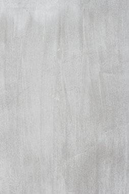 Çizgileri ve çizikleri olan bir inşaat işçisinin gri beton dokusu.